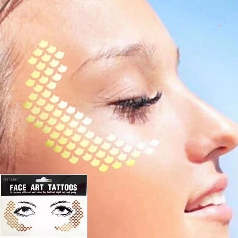 Grimes-Inspired Metallic Face Tattoos
